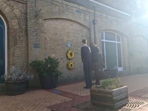 Two students from local academies lay a wreath at Lowestoft Railway Station