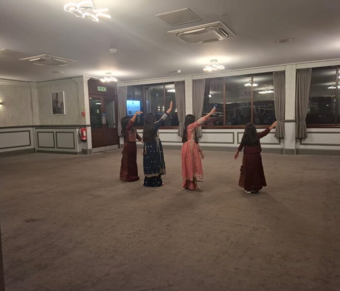 Image of four people dancing