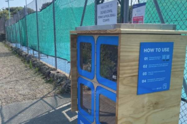 A photo of a blue locker with sports equipment