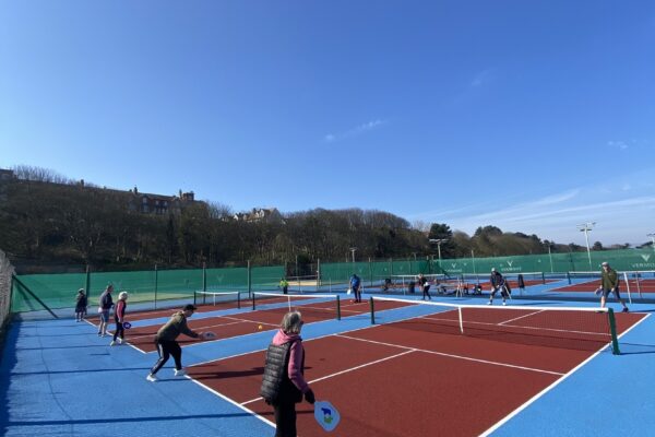 Group of people playing Pickleball