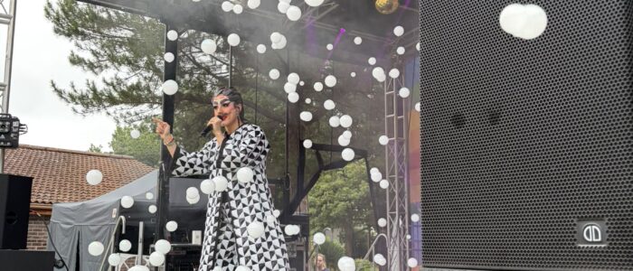 A performer on stage with a bubble machine